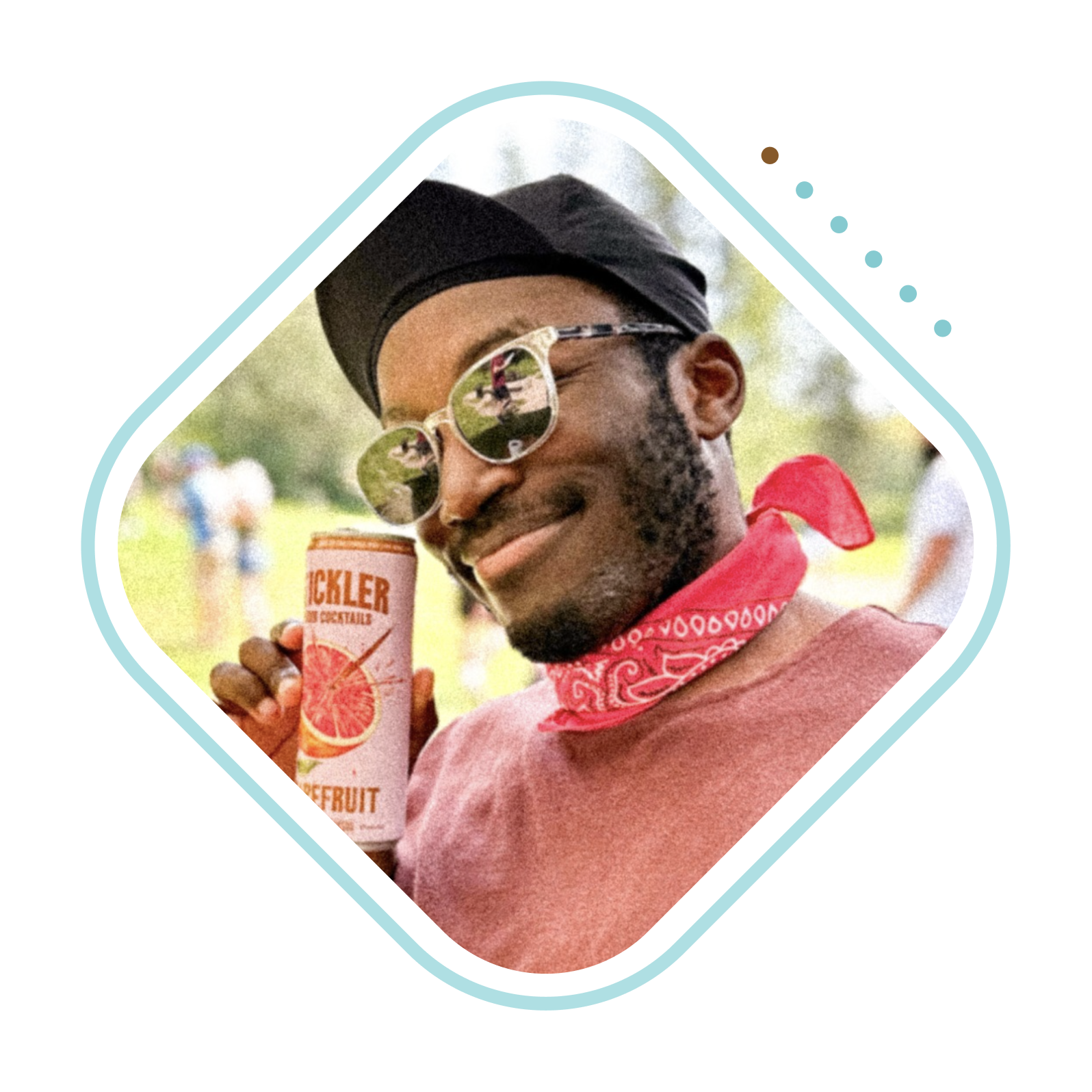 A Stickler fan holding a grapefruit can